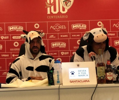 Santa Clara manager and president are dressed as cows in the post game press conference